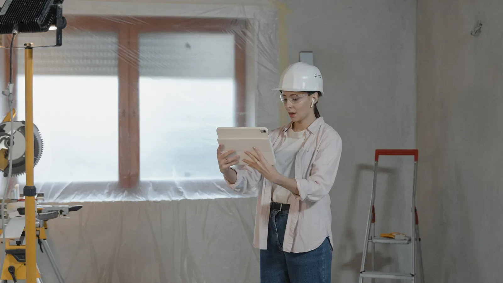 Renovation project manager reviewing site progress during a home renovation