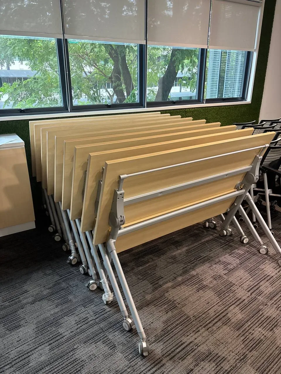 Foldable tables kept together in storage, from CPL Services’ asset recovery imagery